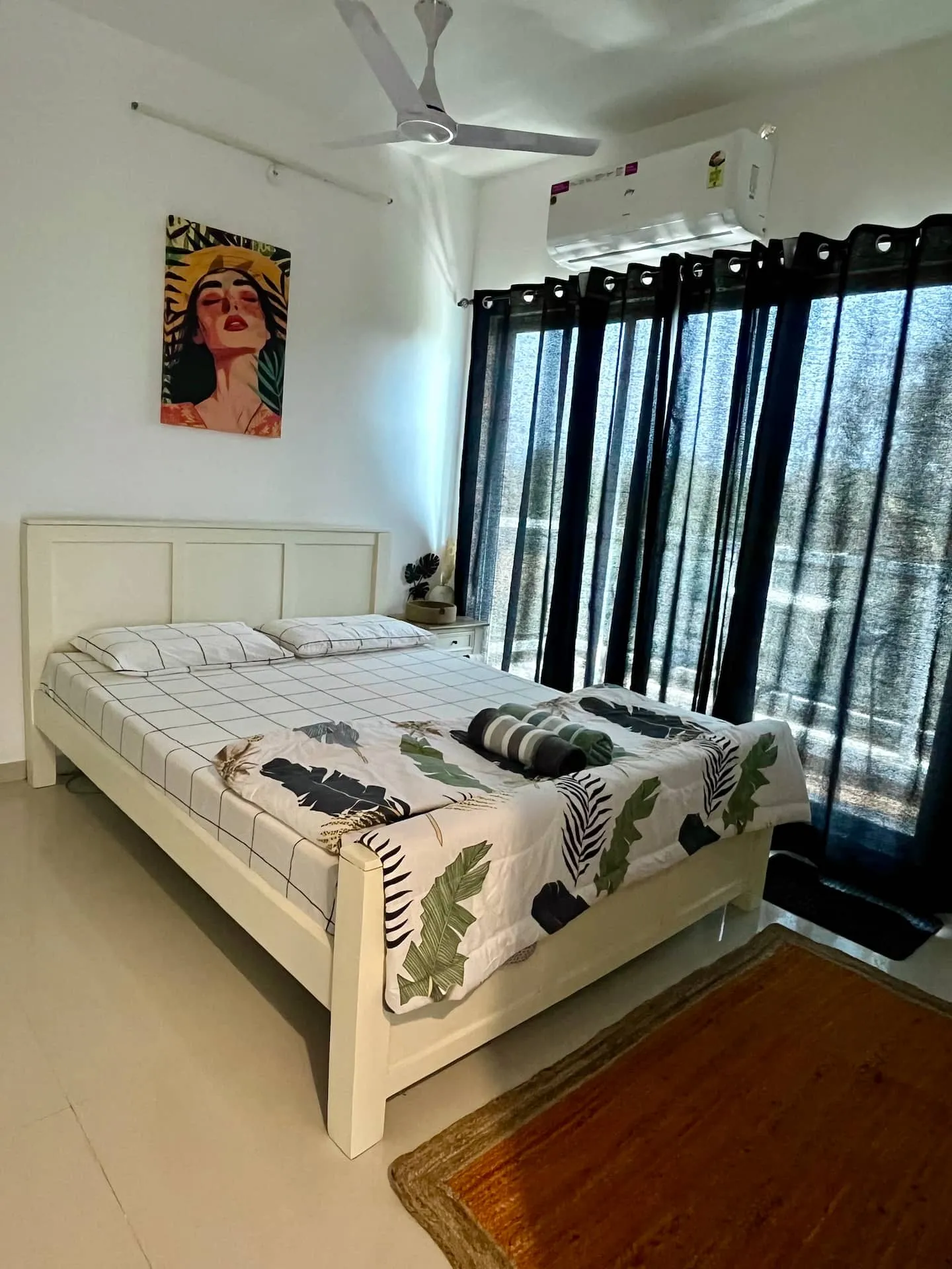 Queen bed facing the window